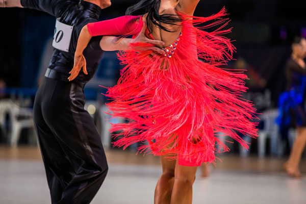 Athletes couple of dancers on ballroom dance contest